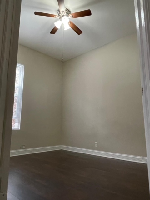 5616 South Indiana Avenue, Unit 2 Chicago, IL 60637 - Photo 5 of 14 an empty room with a window and a fan
