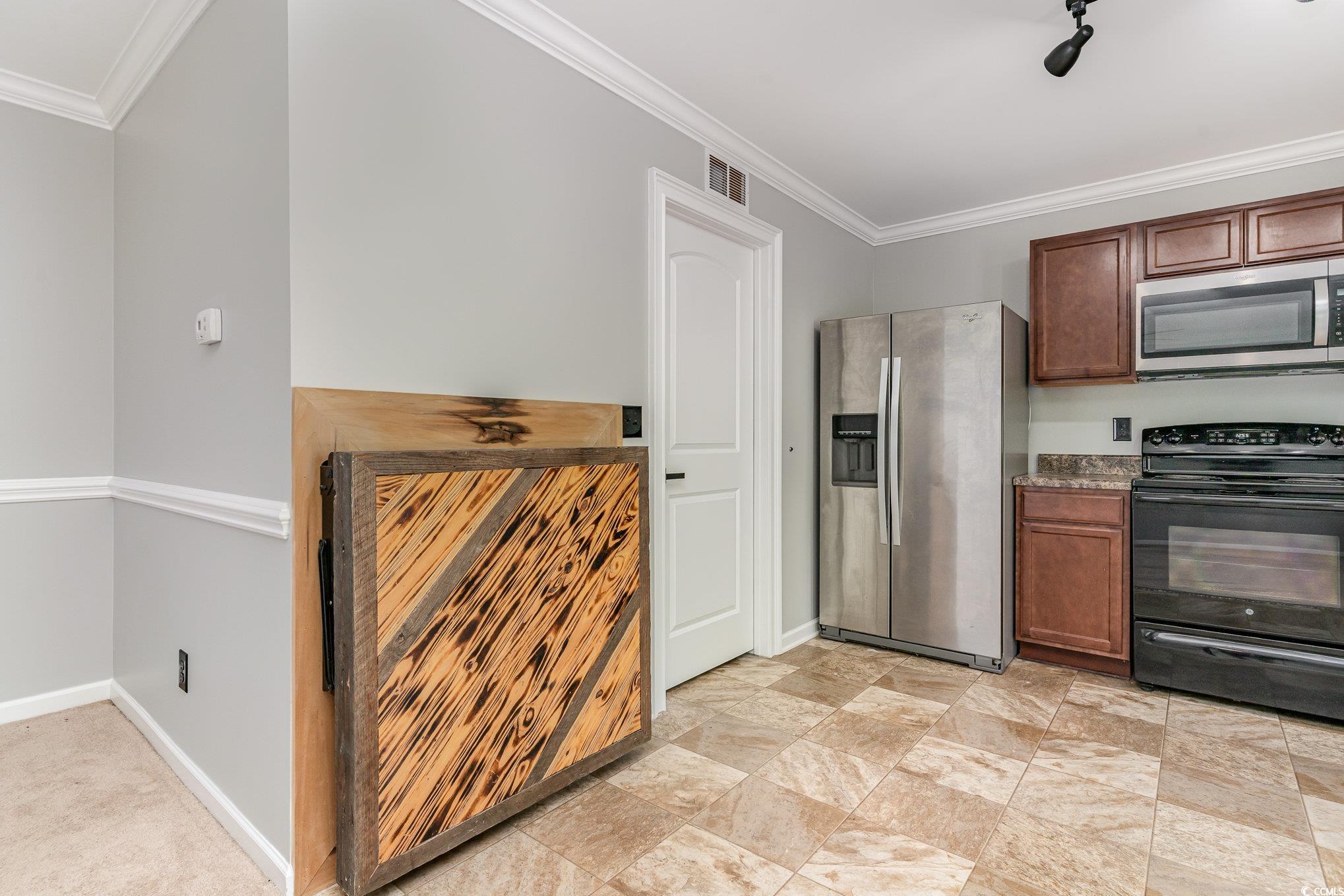 113 Winding Path Drive Loris, SC 29569 - Photo 12 of 36 Kitchen featuring crown molding, appliances with stainless steel finishes, baseboards, and visible vents