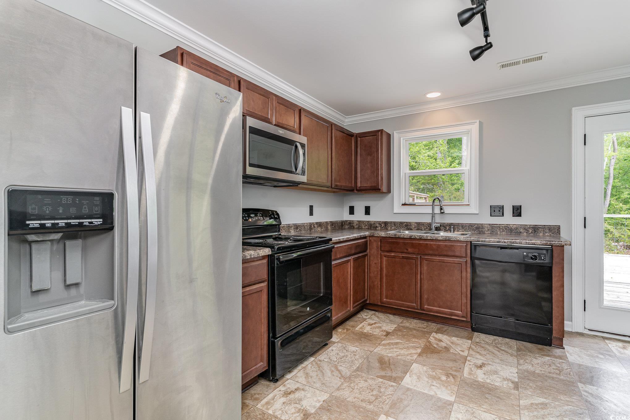 113 Winding Path Drive Loris, SC 29569 - Photo 15 of 36 Kitchen featuring crown molding, visible vents, a sink, and black appliances
