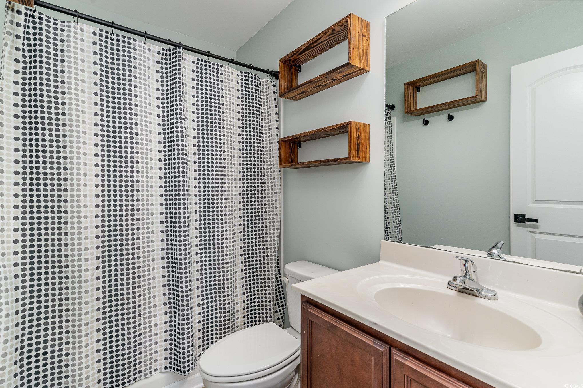 113 Winding Path Drive Loris, SC 29569 - Photo 21 of 36 Full bath with vanity, a shower with curtain, and toilet