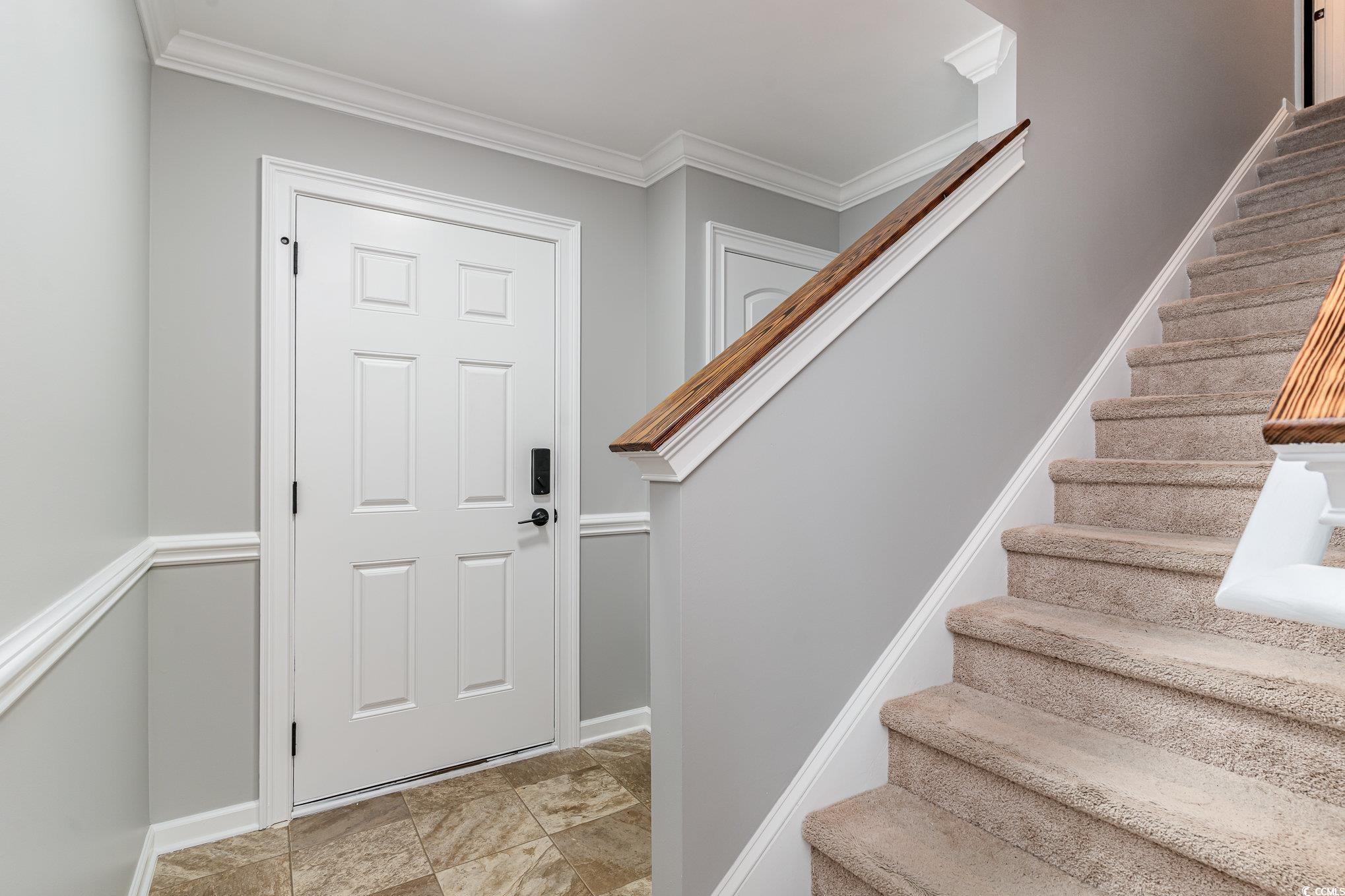 113 Winding Path Drive Loris, SC 29569 - Photo 5 of 36 Foyer with crown molding, stone finish floor, baseboards, and stairs