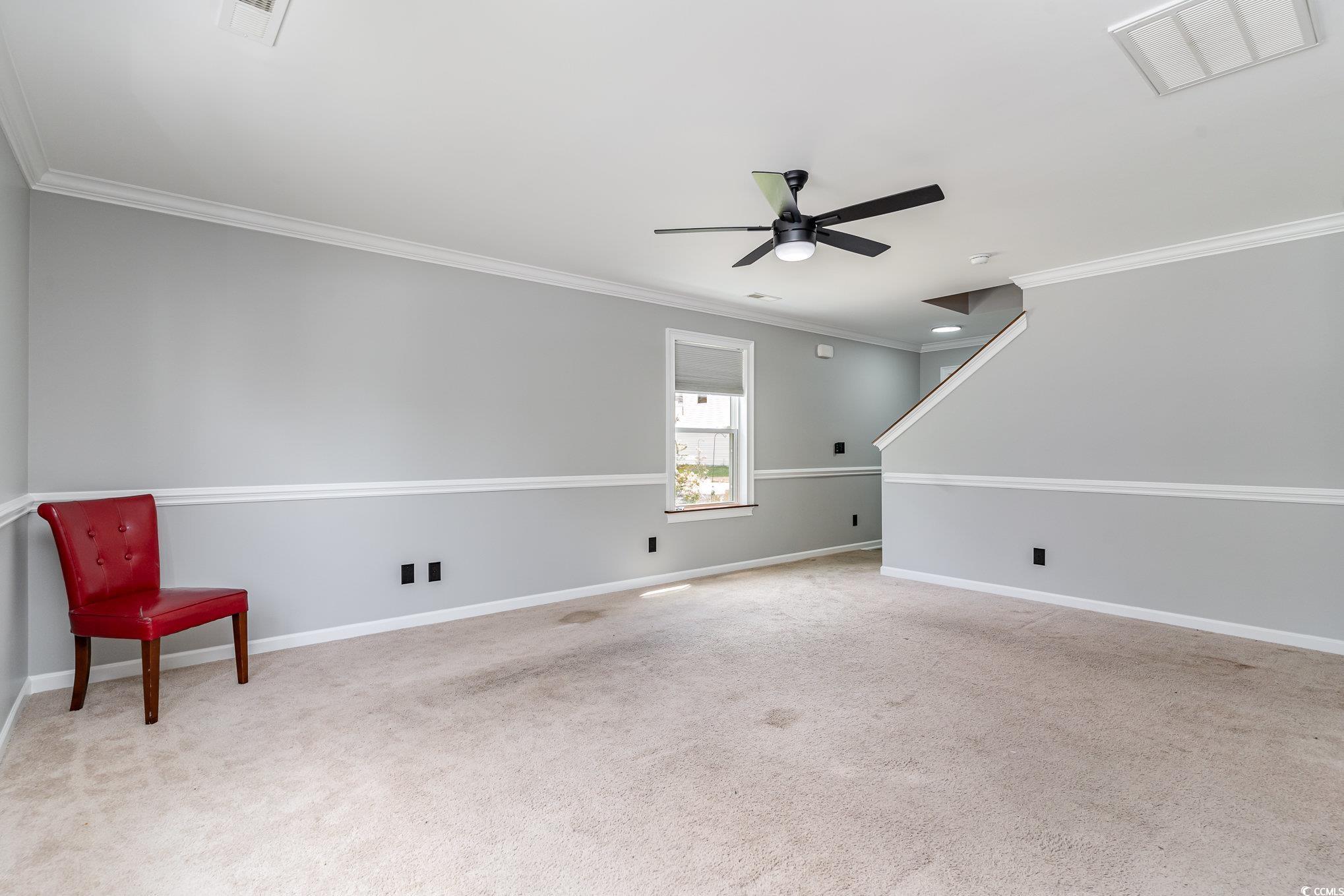 113 Winding Path Drive Loris, SC 29569 - Photo 7 of 36 Interior space with crown molding, ceiling fan, visible vents, carpet flooring, and baseboards