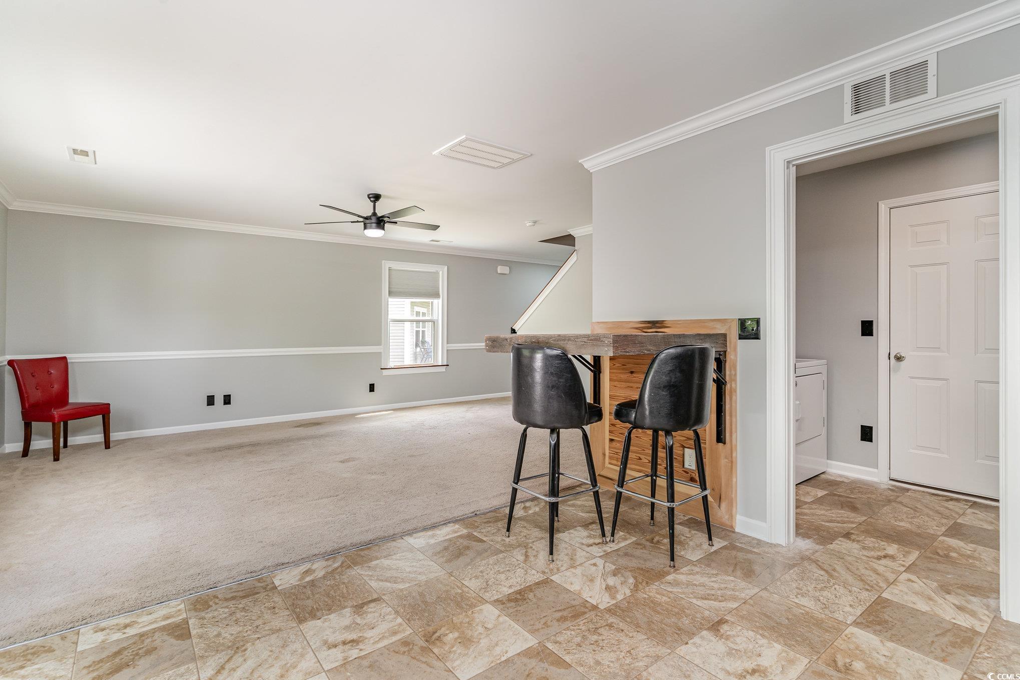 113 Winding Path Drive Loris, SC 29569 - Photo 10 of 36 Kitchen featuring baseboards, ornamental molding, and visible vents