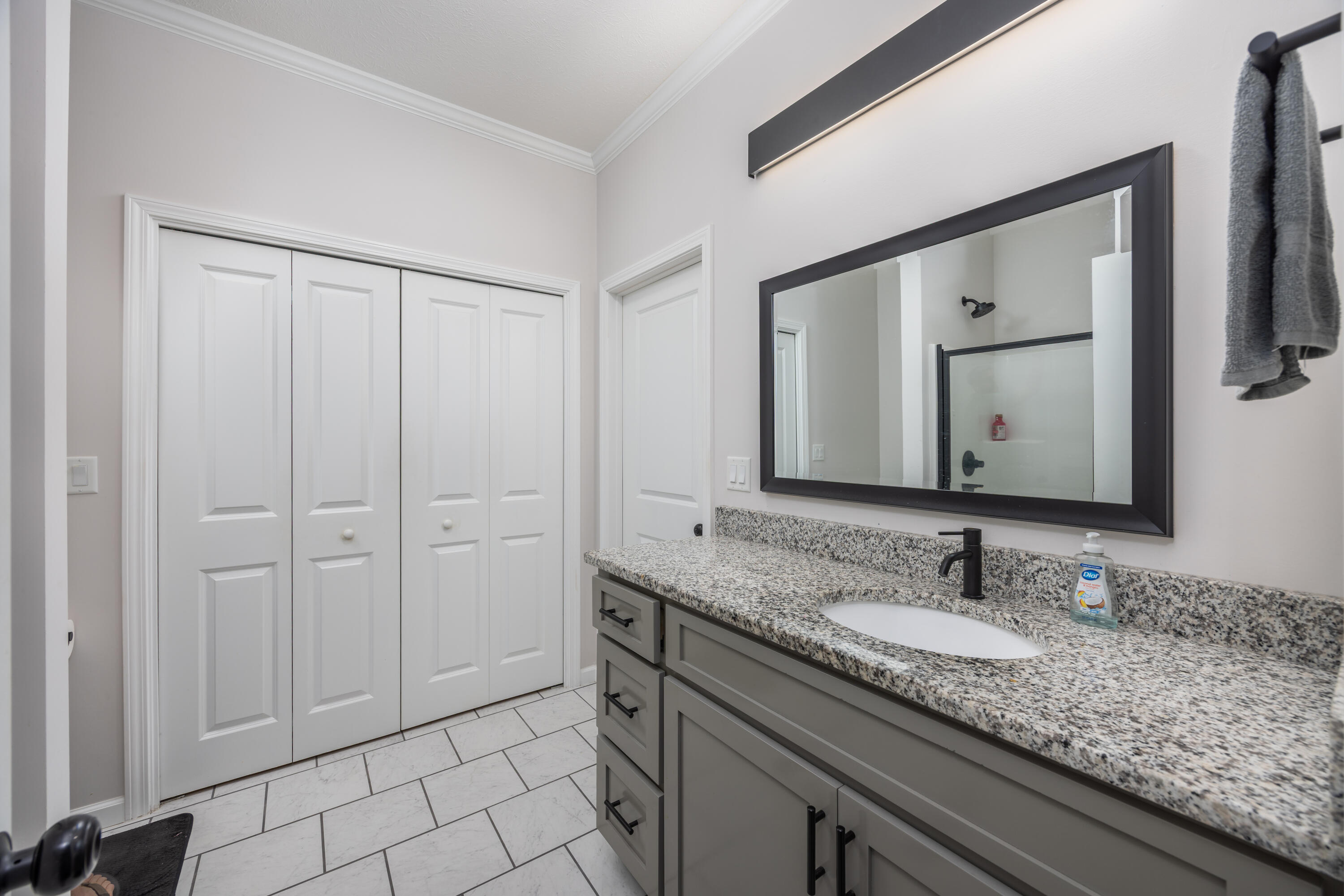 158 Johns Lane Freeport, FL 32439 - Photo 14 of 36 a bathroom with a granite countertop double vanity sink and a mirror