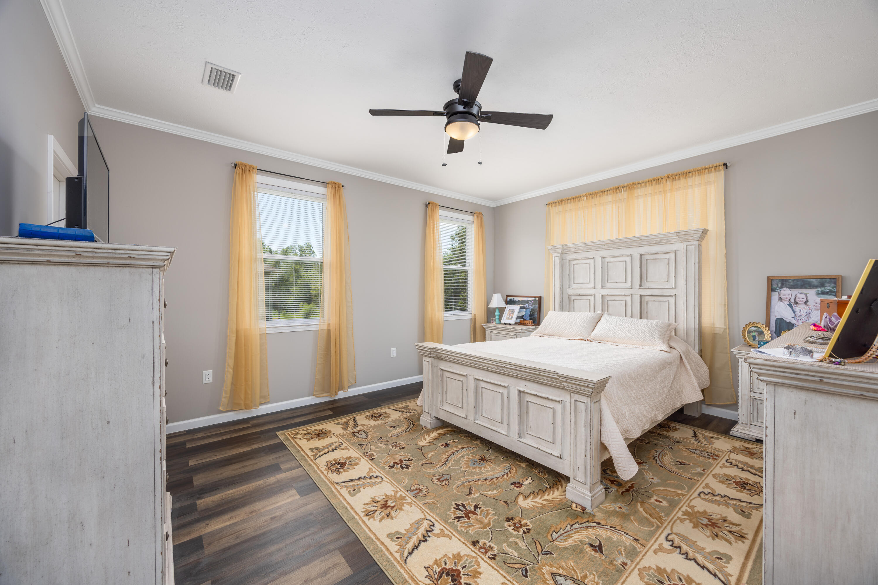 158 Johns Lane Freeport, FL 32439 - Photo 15 of 36 a bedroom with a large bed and a window