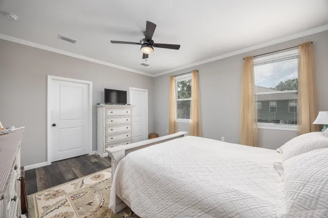 a spacious bedroom with a bed and a window