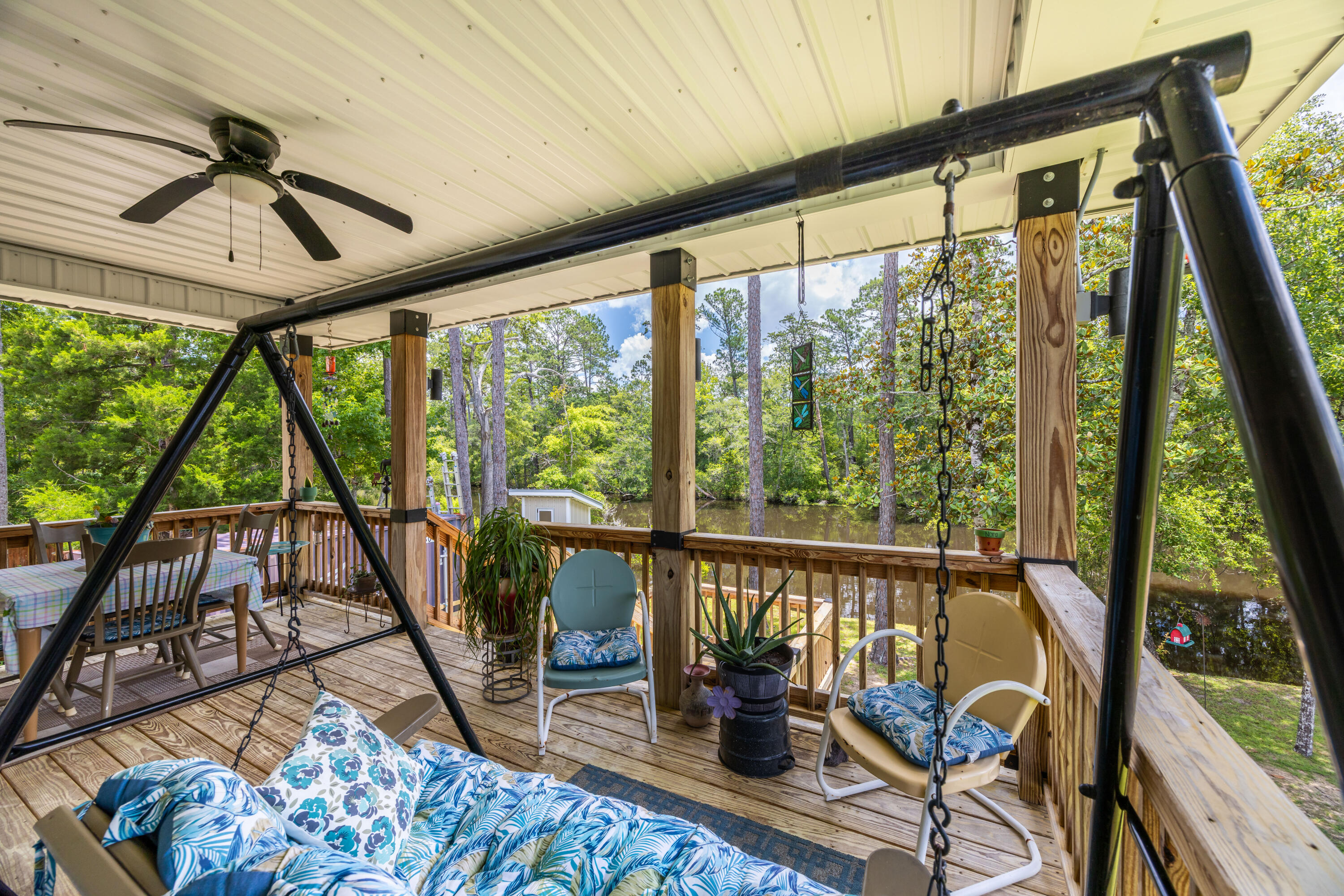 158 Johns Lane Freeport, FL 32439 - Photo 19 of 36 a living room with large windows