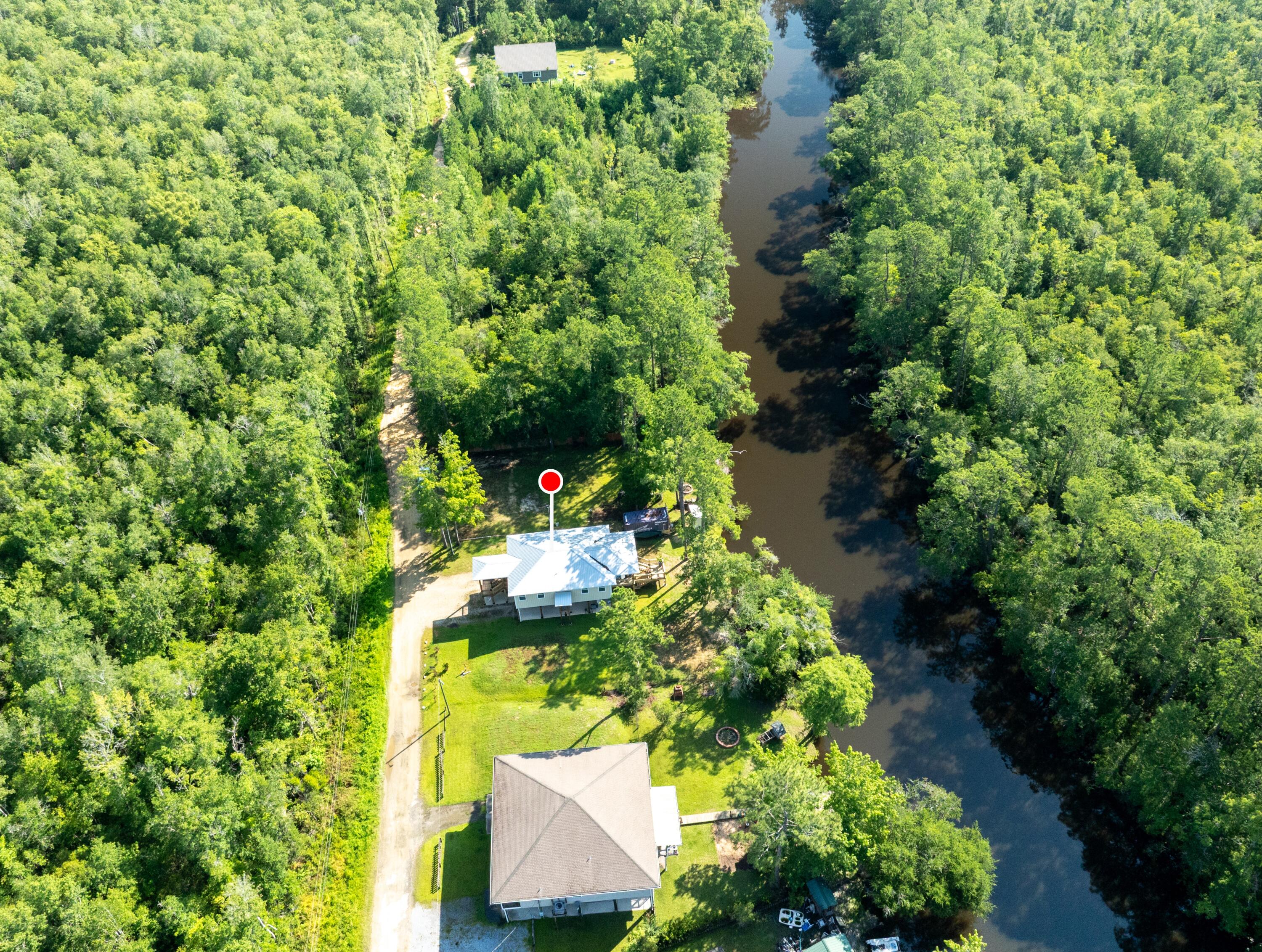 158 Johns Lane Freeport, FL 32439 - Photo 2 of 36 a picture of trees