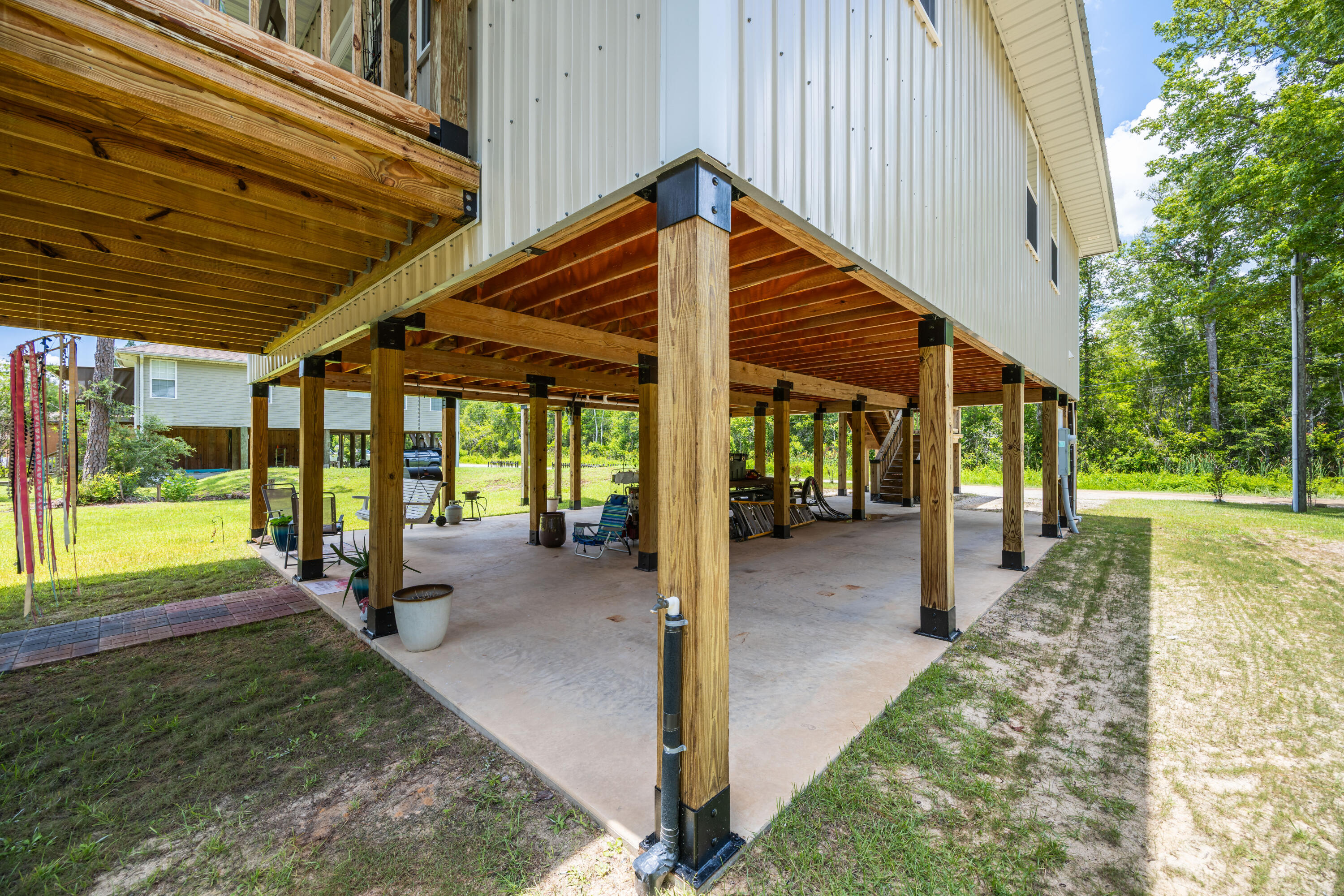 158 Johns Lane Freeport, FL 32439 - Photo 23 of 36 a view of a house with backyard and porch