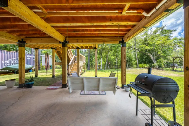 a swimming pool with yard and outdoor seating