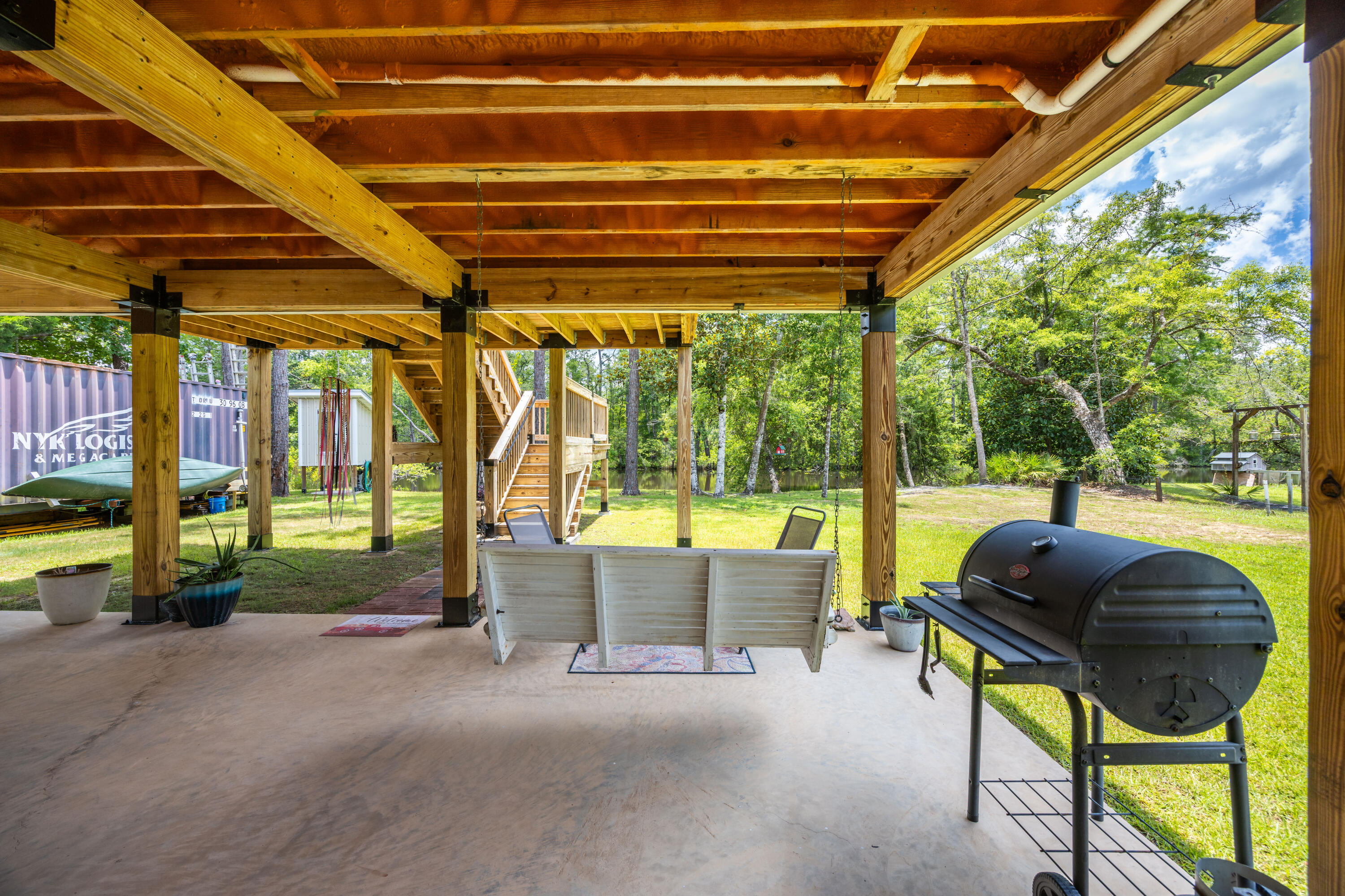 158 Johns Lane Freeport, FL 32439 - Photo 24 of 36 a swimming pool with yard and outdoor seating