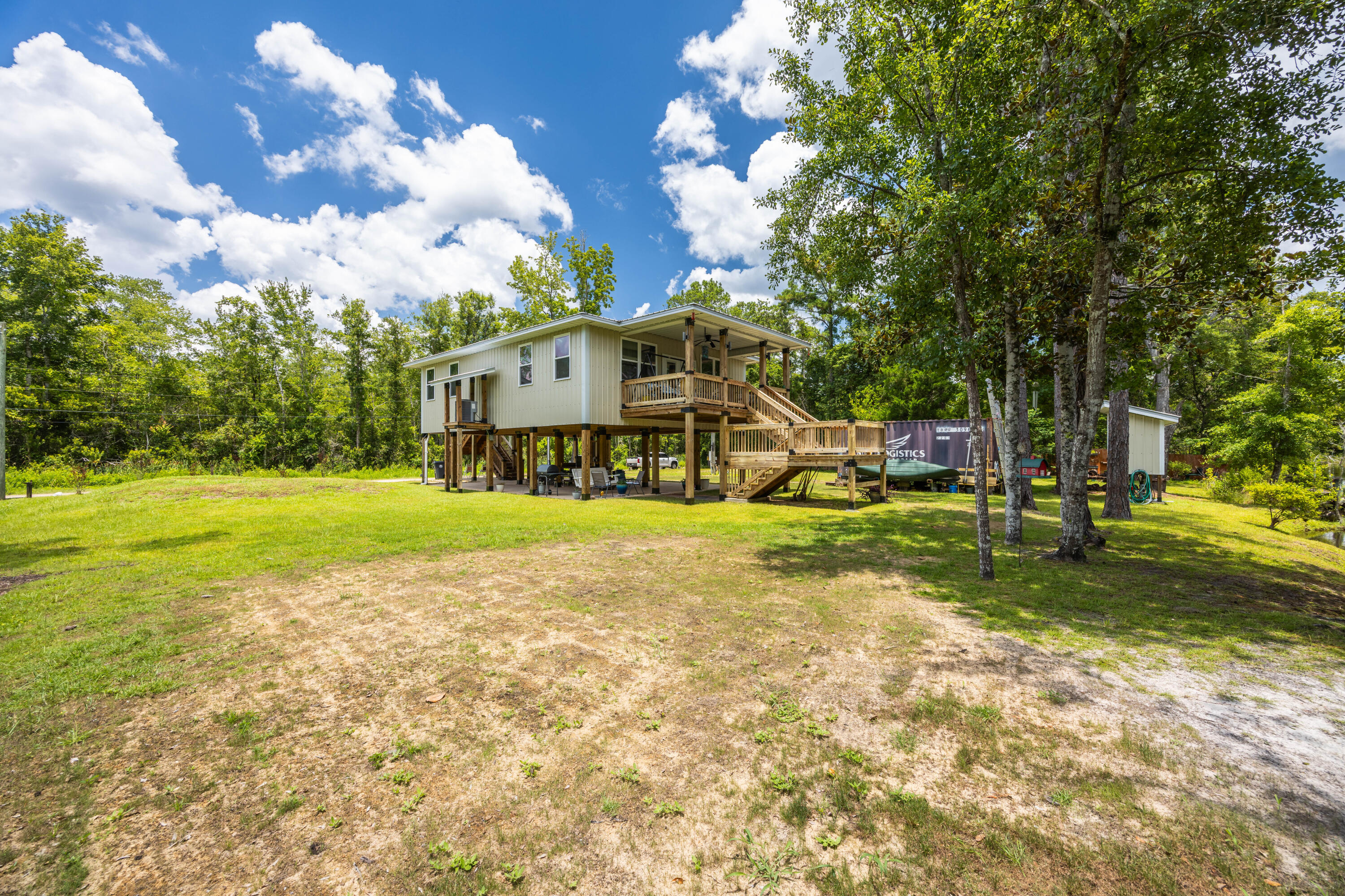 158 Johns Lane Freeport, FL 32439 - Photo 28 of 36 a view of a house with a big yard