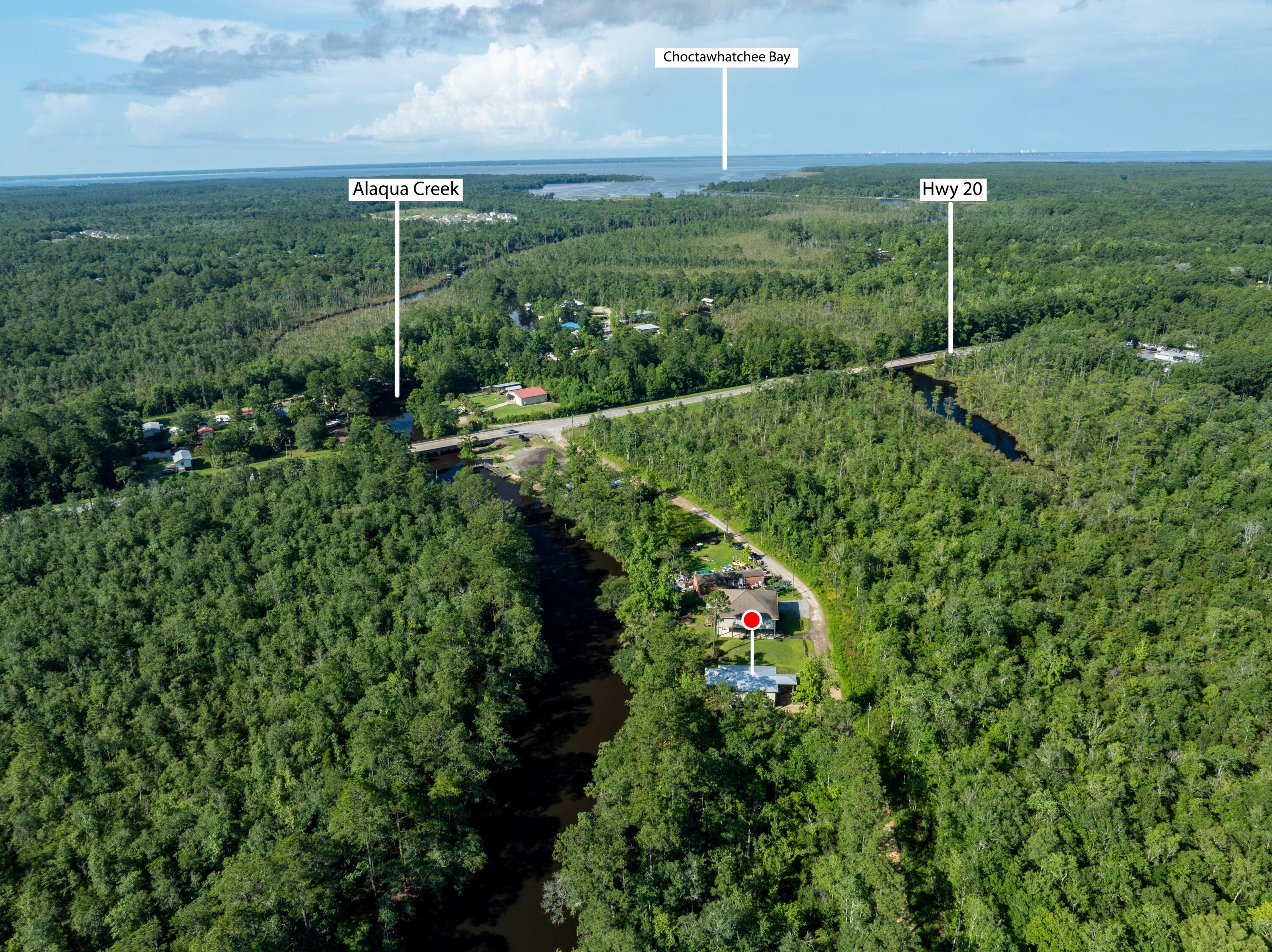 158 Johns Lane Freeport, FL 32439 - Photo 3 of 36 a view of a garden with a building
