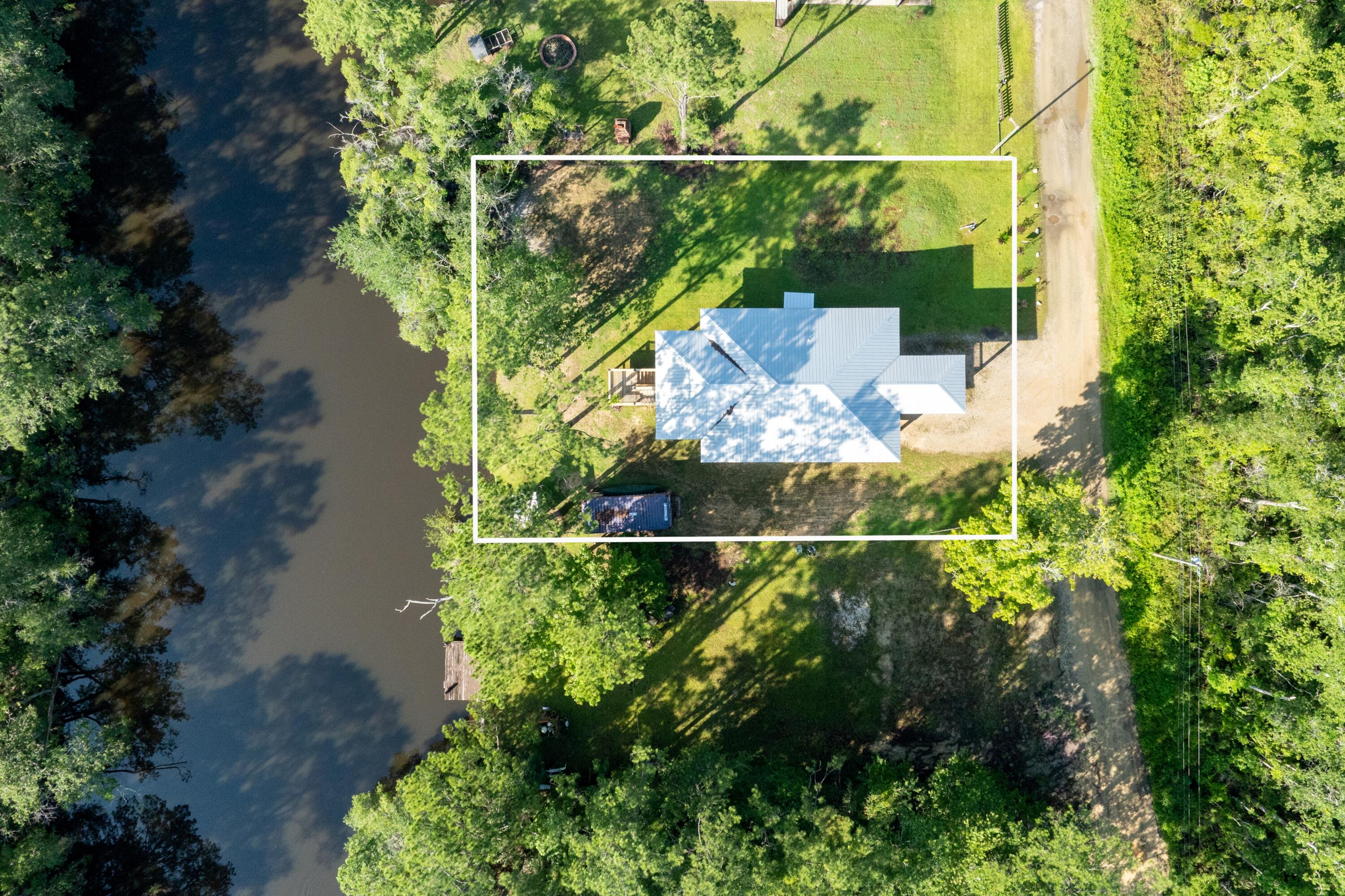 158 Johns Lane Freeport, FL 32439 - Photo 4 of 36 an aerial view of a house with a yard