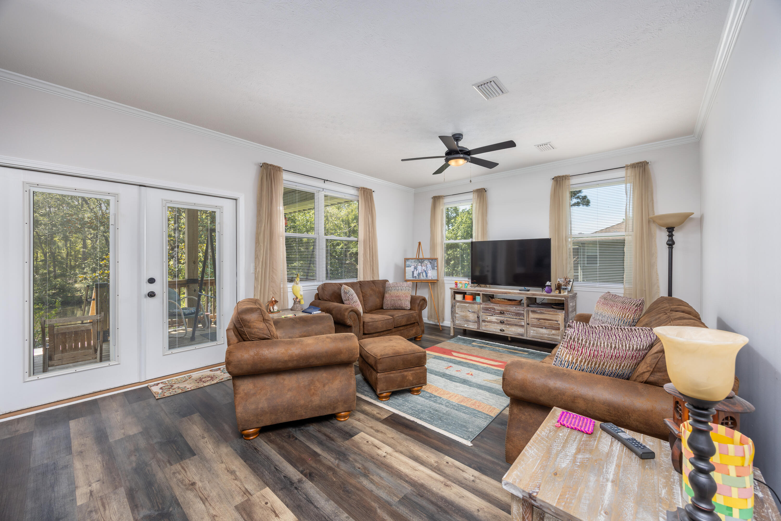 158 Johns Lane Freeport, FL 32439 - Photo 6 of 36 a living room with furniture and a flat screen tv