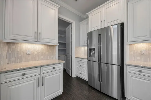 a kitchen with stainless steel appliances a stove top oven and a sink