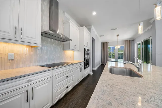 a kitchen with appliances and cabinets