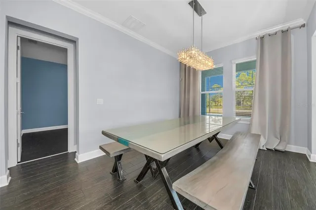 a view of a kitchen with wooden floor and a kitchen