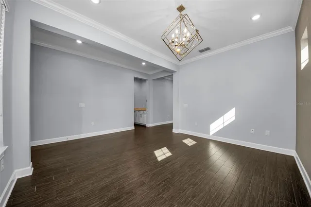 a bathroom with a glass door shower a sink and a toilet