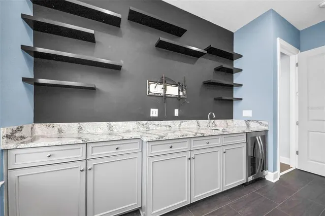 an empty room with a empty space and windows