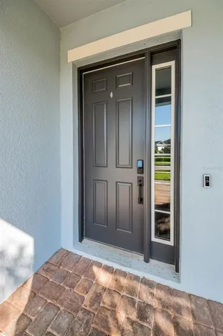 a large kitchen with stainless steel appliances kitchen island a large counter top and a stove top oven