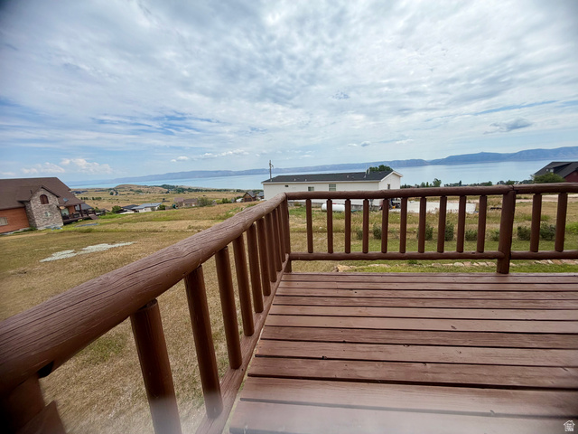 358 Maple Drive Fish Haven, ID 83287 - Photo 5 of 21 Expansive outdoor deck featuring wood-finish flooring and a rustic log railing