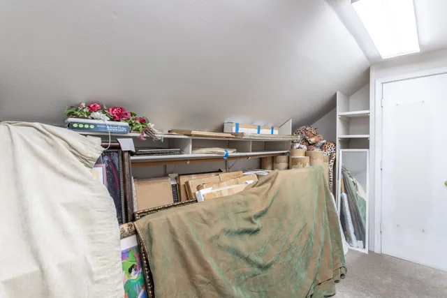 a view of a balcony with table and chairs