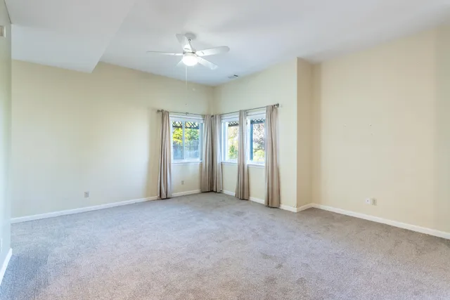 a outdoor space with lounge chair and windows