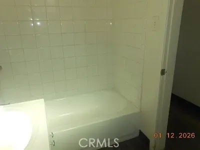 a stove top oven sitting inside of a kitchen