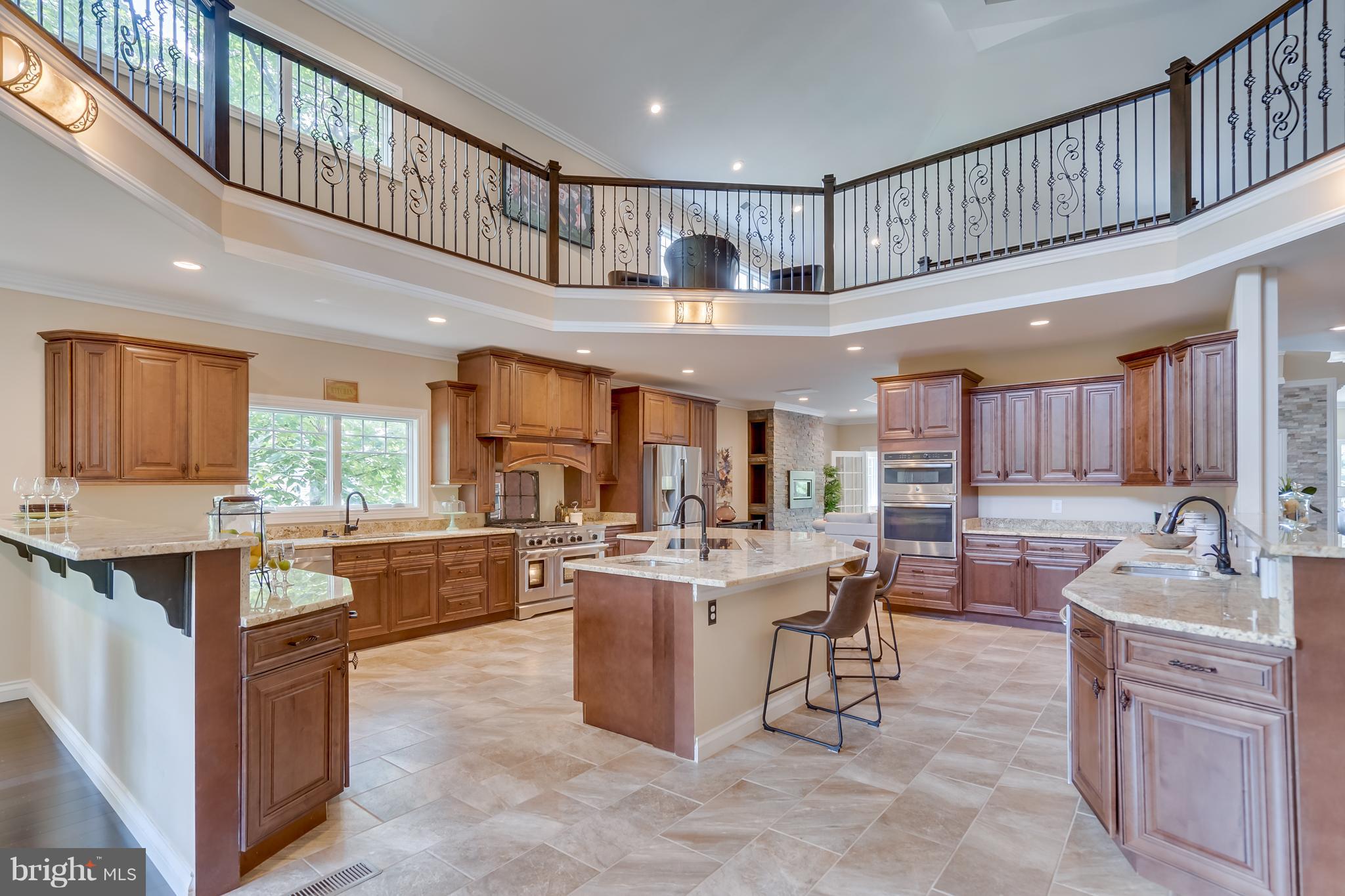 1415 Julia Avenue McLean, VA 22101 - Photo 4 of 30 a kitchen with kitchen island granite countertop lots of counter top space