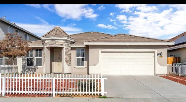 a front view of a house with a garage