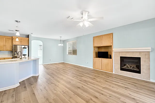 a kitchen with kitchen island a sink stove and refrigerator
