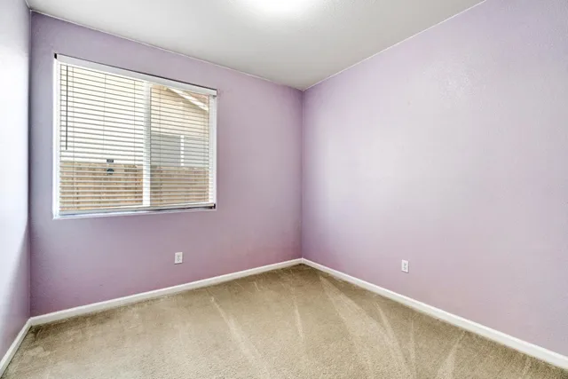 an empty room with closet area