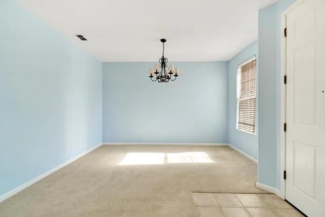 a view of empty room with windows