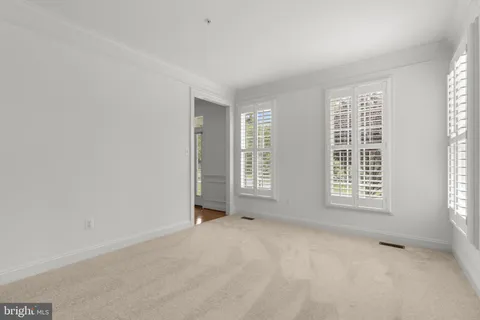a kitchen with stainless steel appliances granite countertop a stove a sink dishwasher and a microwave oven with wooden floor
