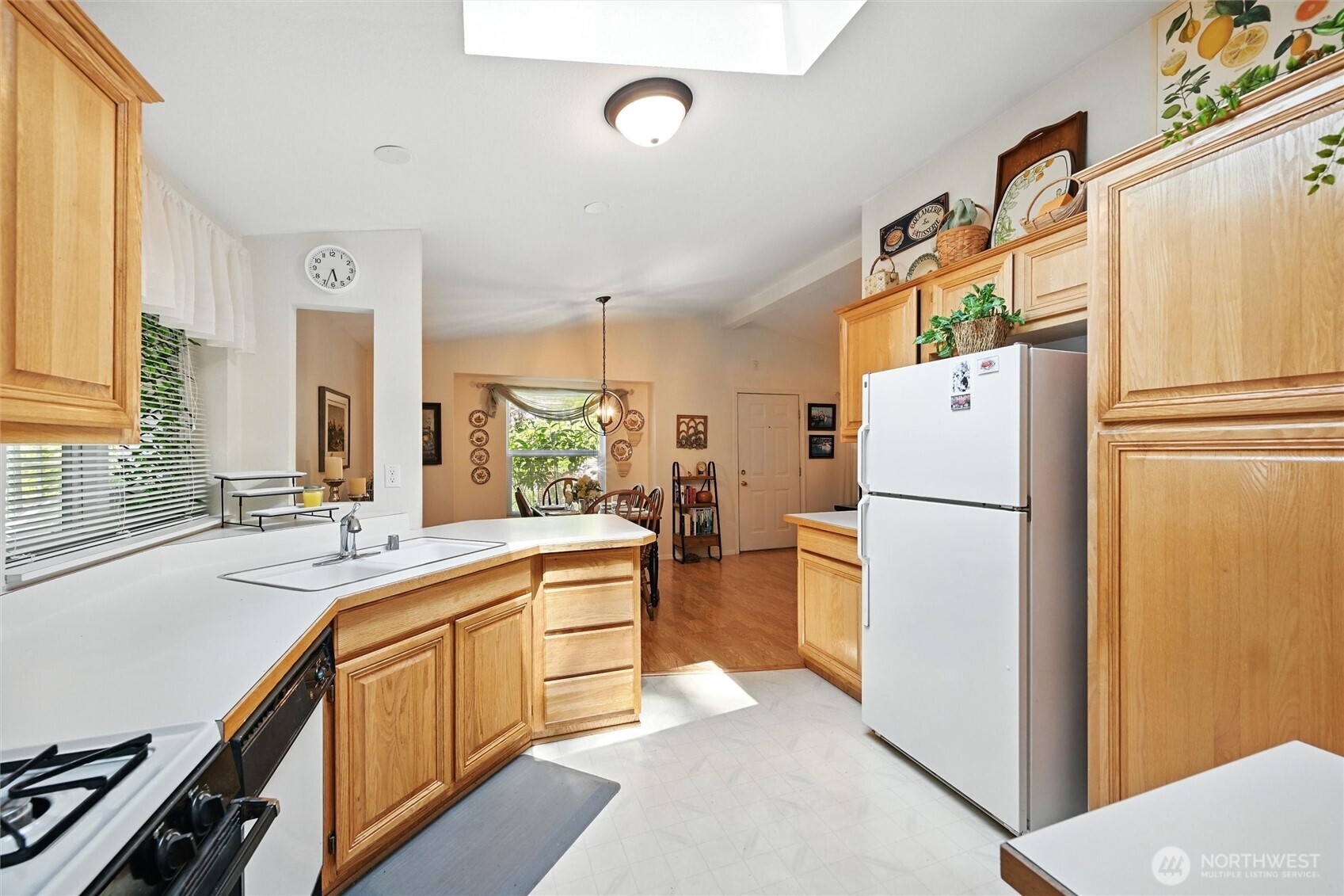 4949 Samish Way, Unit 56 Bellingham, WA 98229 - Photo 19 of 33 a kitchen with a refrigerator a sink and dishwasher