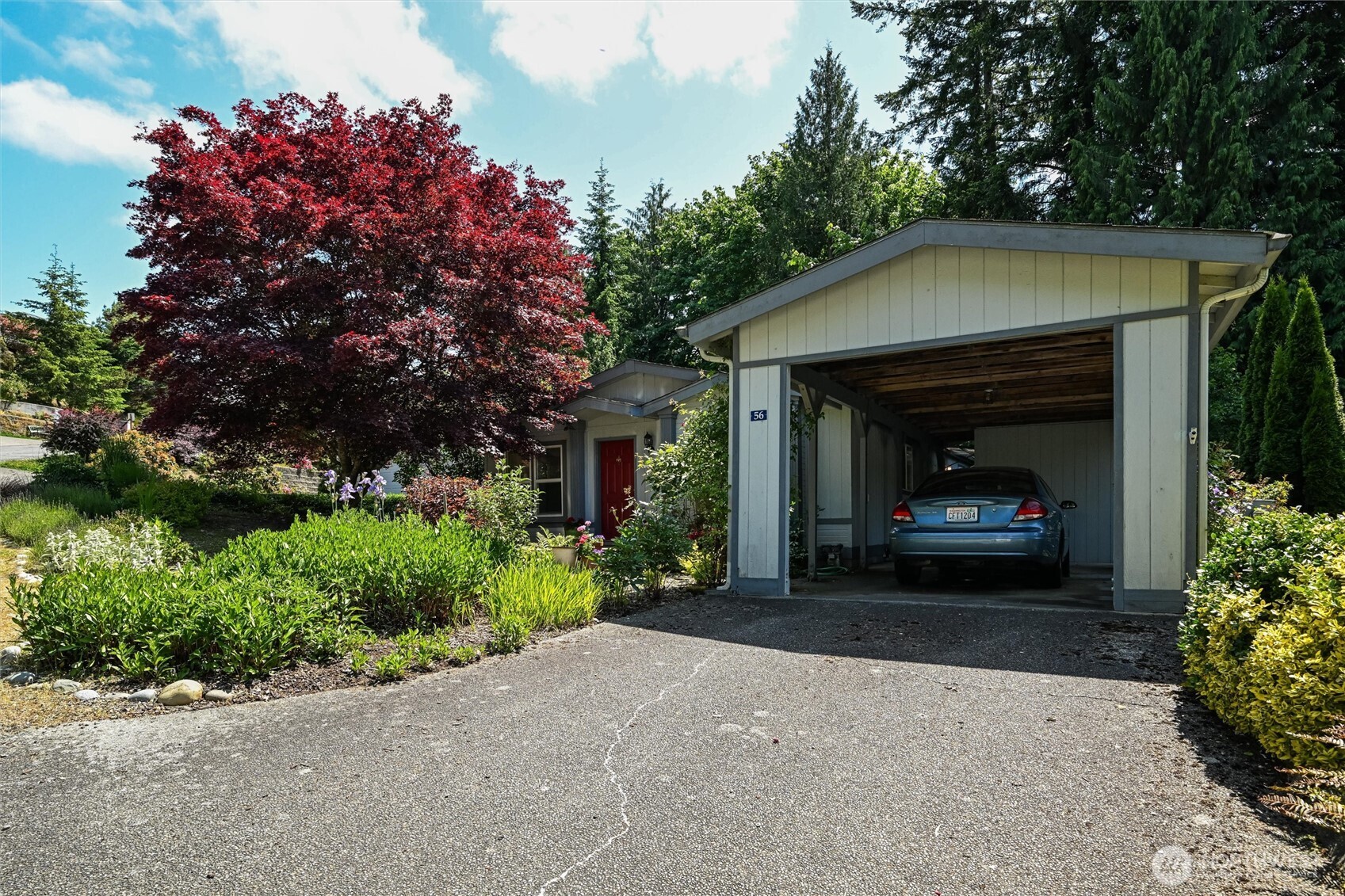 4949 Samish Way, Unit 56 Bellingham, WA 98229 - Photo 7 of 33 a front view of a house with a garden