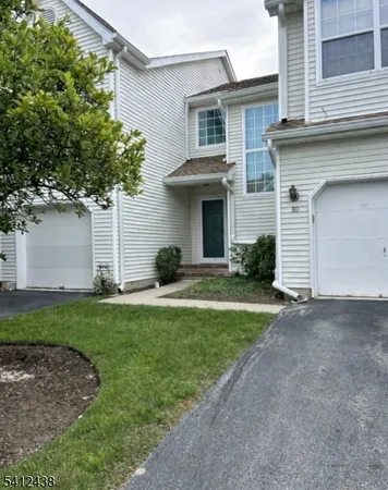 a view of a yard in front of a house