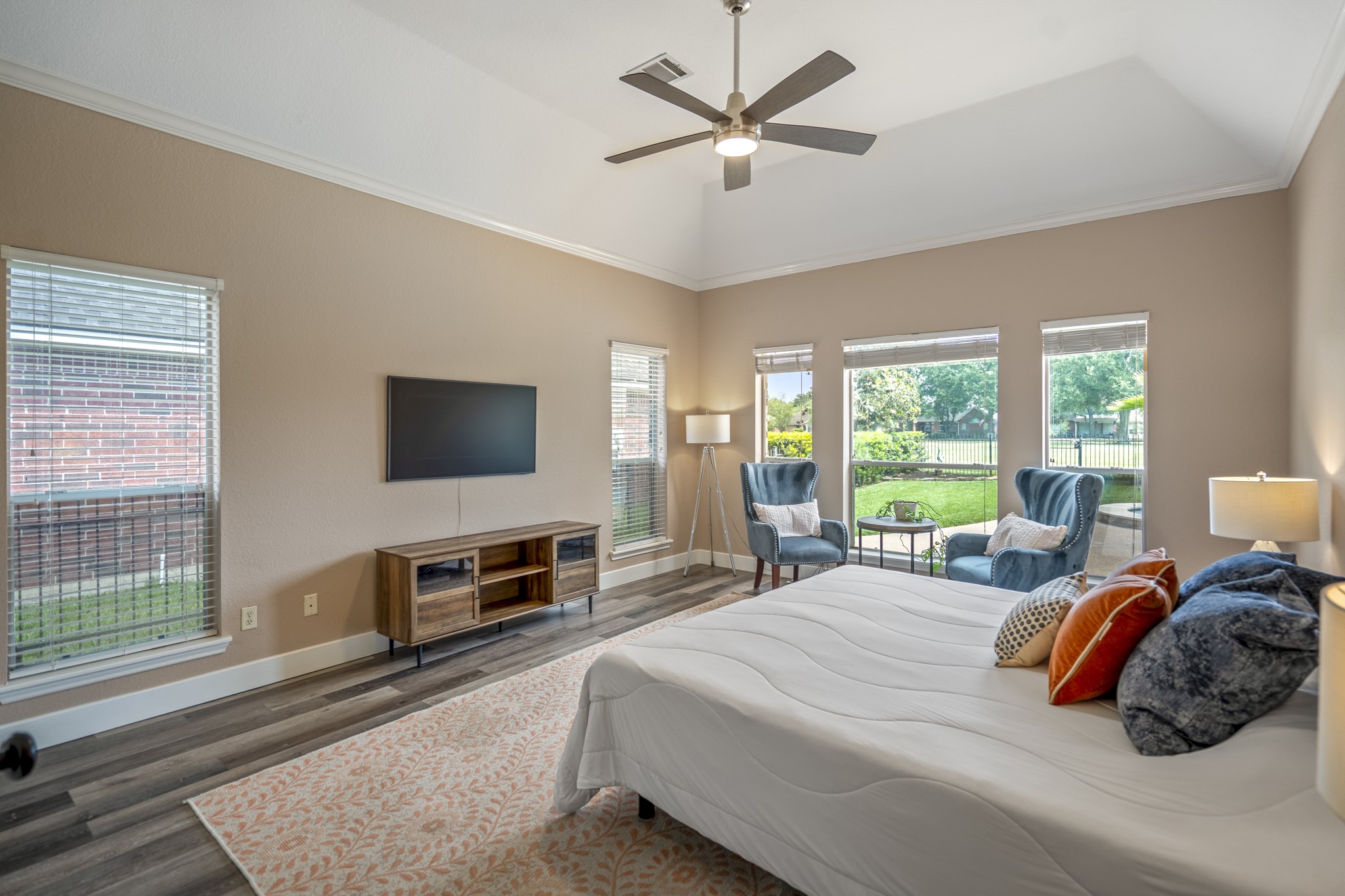 5835 Pinelake Crossing Drive Spring, TX 77379 - Photo 21 of 50 A second look at the primary suite highlights the peaceful setting with views extending past the pool and out to the golf course beyond. Natural light fills the room, while the open backdrop creates a calm, tucked-away feel.