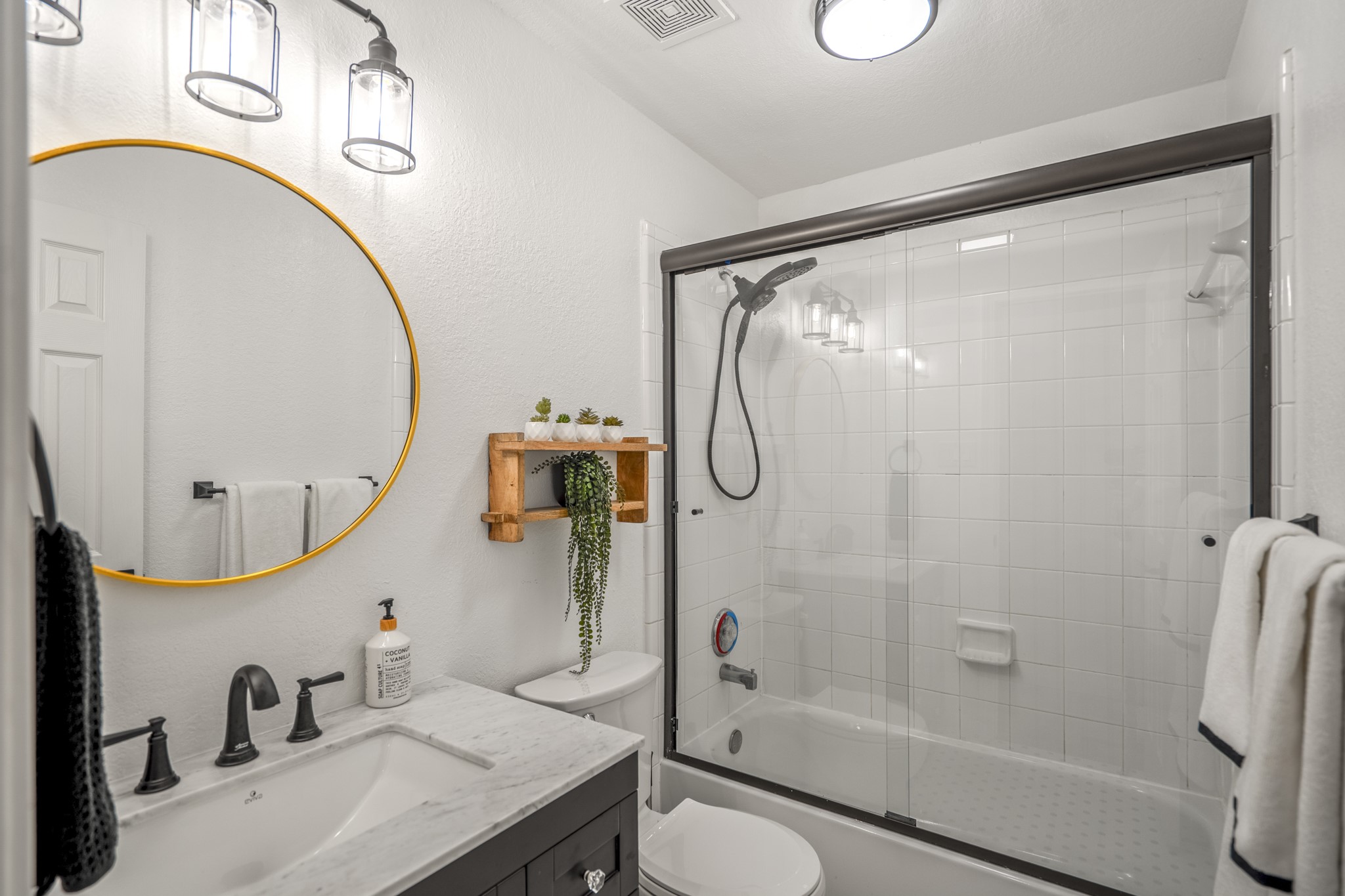 5835 Pinelake Crossing Drive Spring, TX 77379 - Photo 29 of 50 The second full bathroom upstairs is conveniently located off the hallway near the game room, featuring an updated vanity with modern fixtures and a tub/shower combo with glass enclosure for a clean, refreshed look.