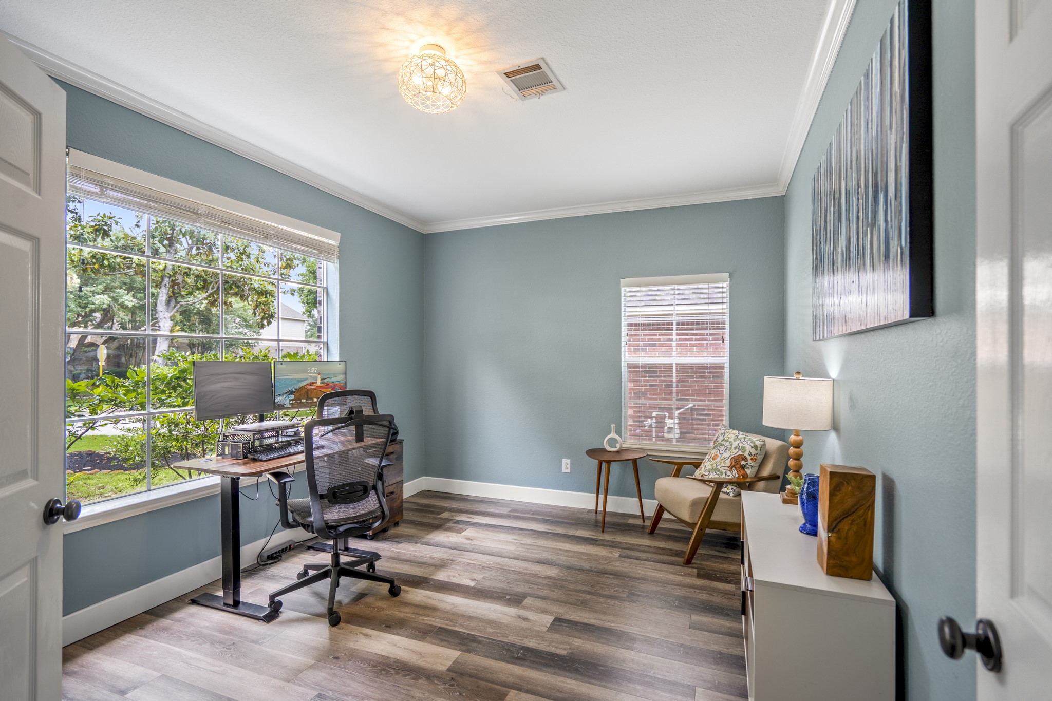 5835 Pinelake Crossing Drive Spring, TX 77379 - Photo 5 of 50 Tucked to the left of the entry, the study features a wide front-facing window that brings in natural light and views of the front yard.
