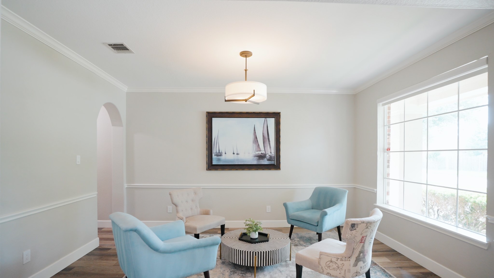 5835 Pinelake Crossing Drive Spring, TX 77379 - Photo 6 of 50 Natural light fills this front flex space, designed to adapt as a sitting area or formal dining, with an arched opening that carries you through to the kitchen.
