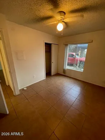 a view of an empty room with a window