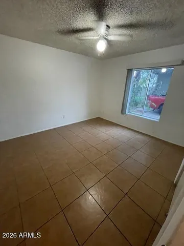 a view of an empty room with windows