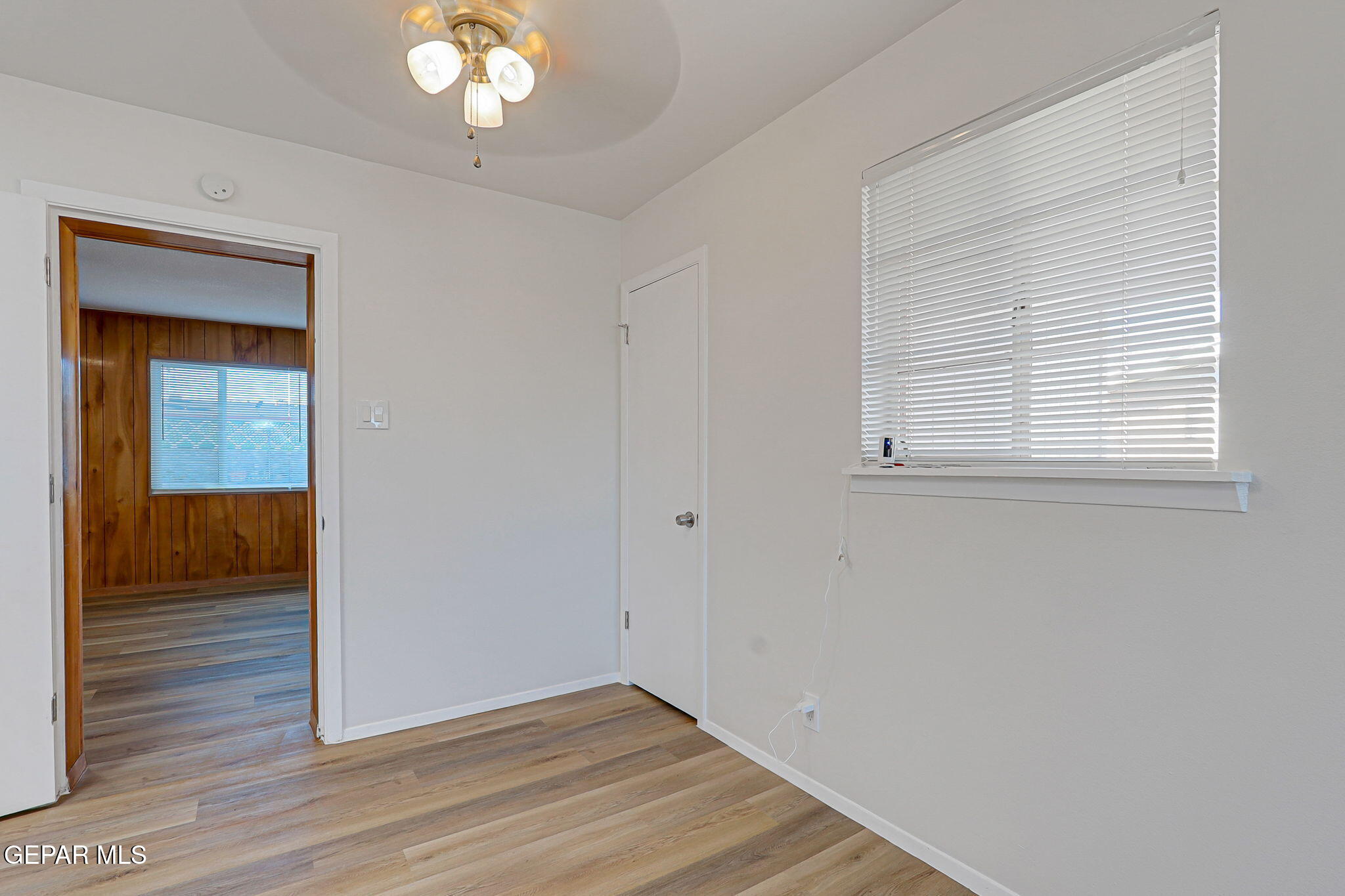 2801 Dunoon Drive El Paso, TX 79925 - Photo 26 of 41 wooden floor in an empty room with a window
