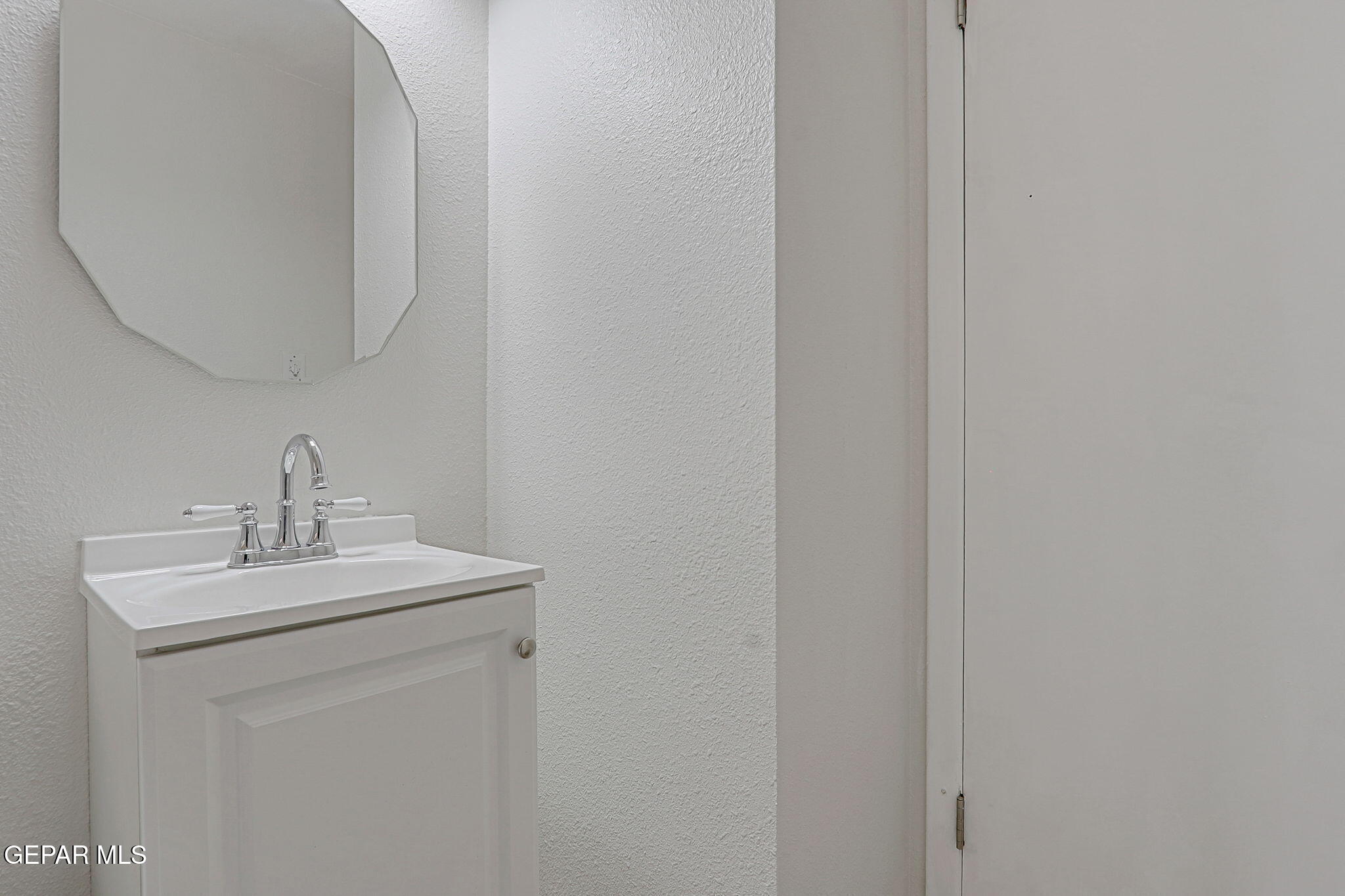 2801 Dunoon Drive El Paso, TX 79925 - Photo 32 of 41 a bathroom with a sink a mirror and vanity