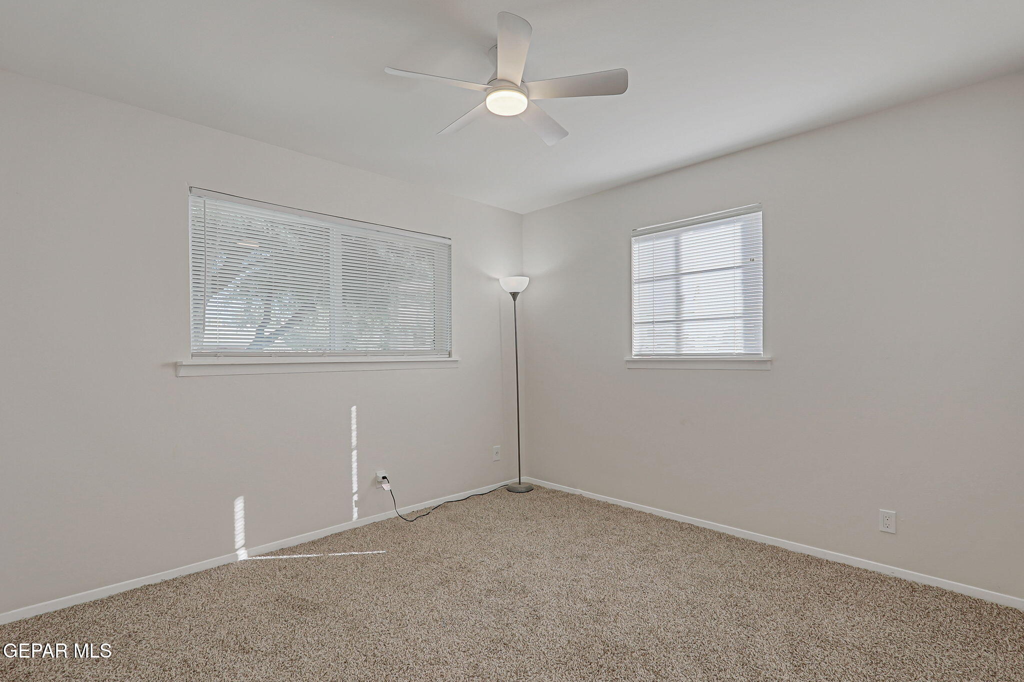 2801 Dunoon Drive El Paso, TX 79925 - Photo 35 of 41 an empty room with windows and closet
