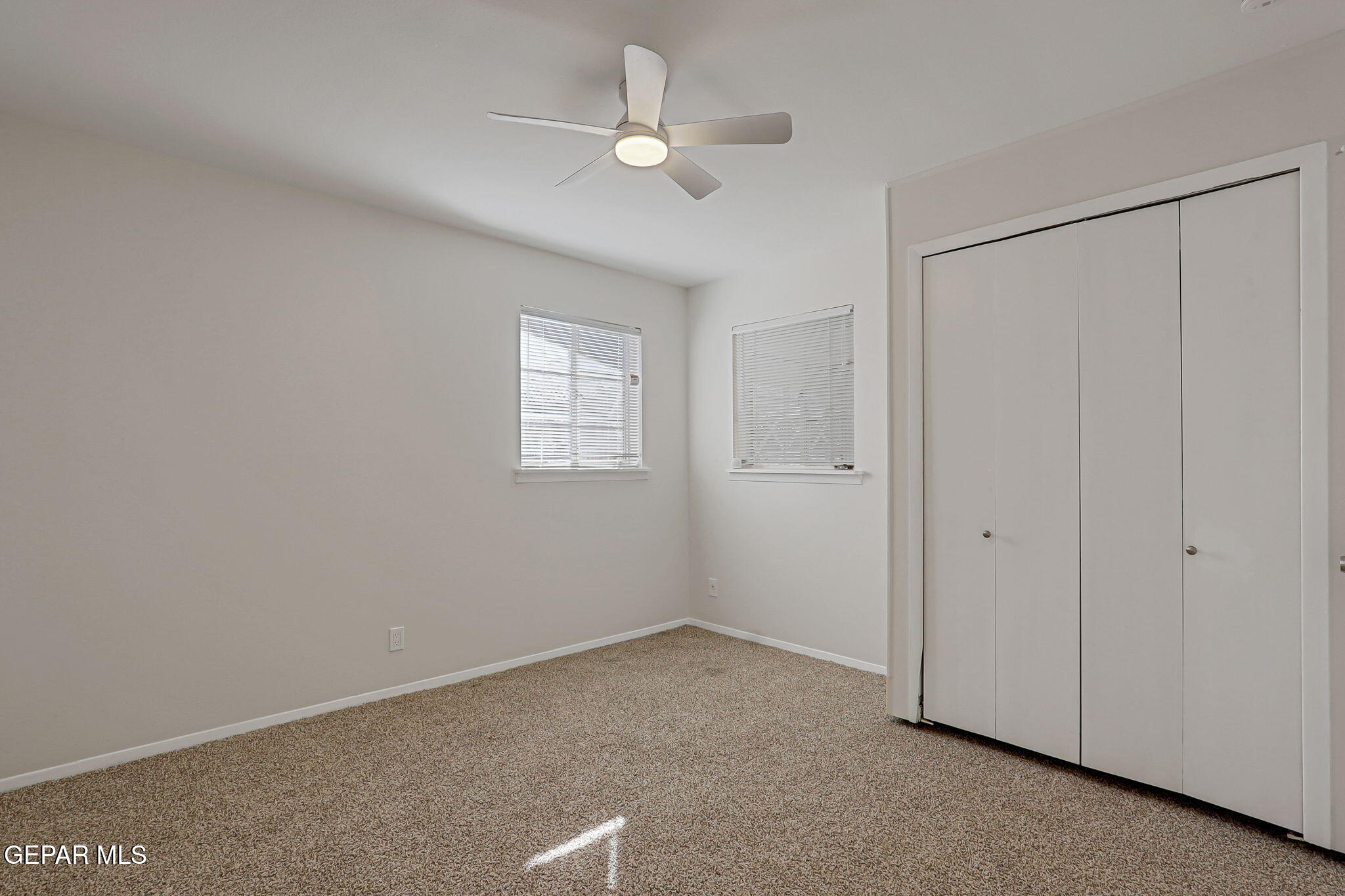 2801 Dunoon Drive El Paso, TX 79925 - Photo 37 of 41 a view of an empty room with a ceiling fan and a window