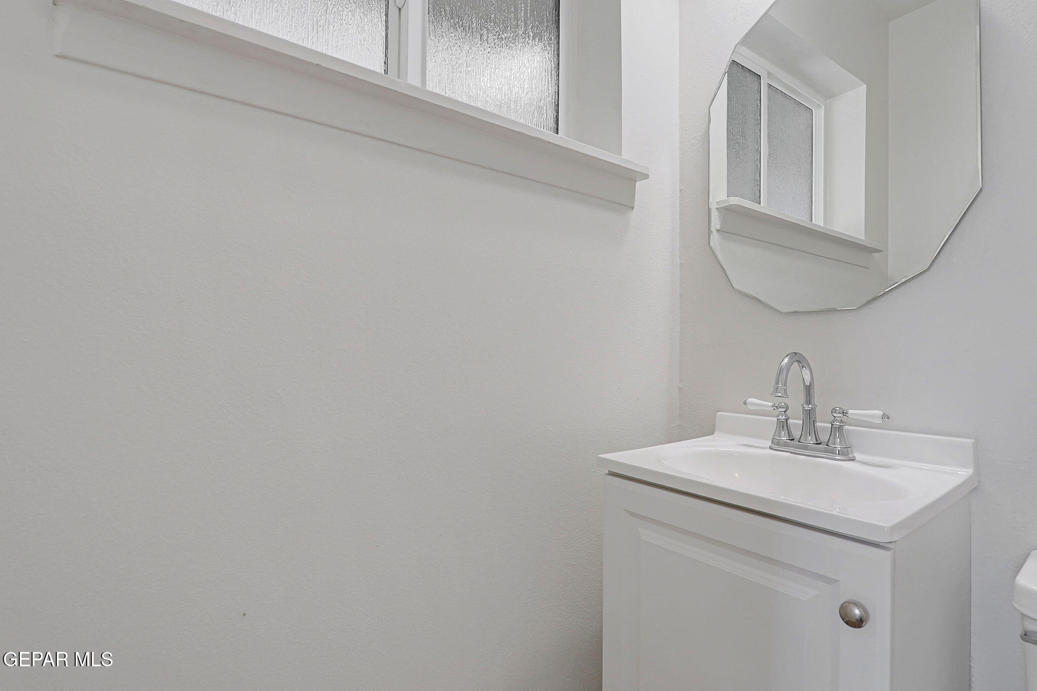 2801 Dunoon Drive El Paso, TX 79925 - Photo 40 of 41 a bathroom with a sink and a mirror