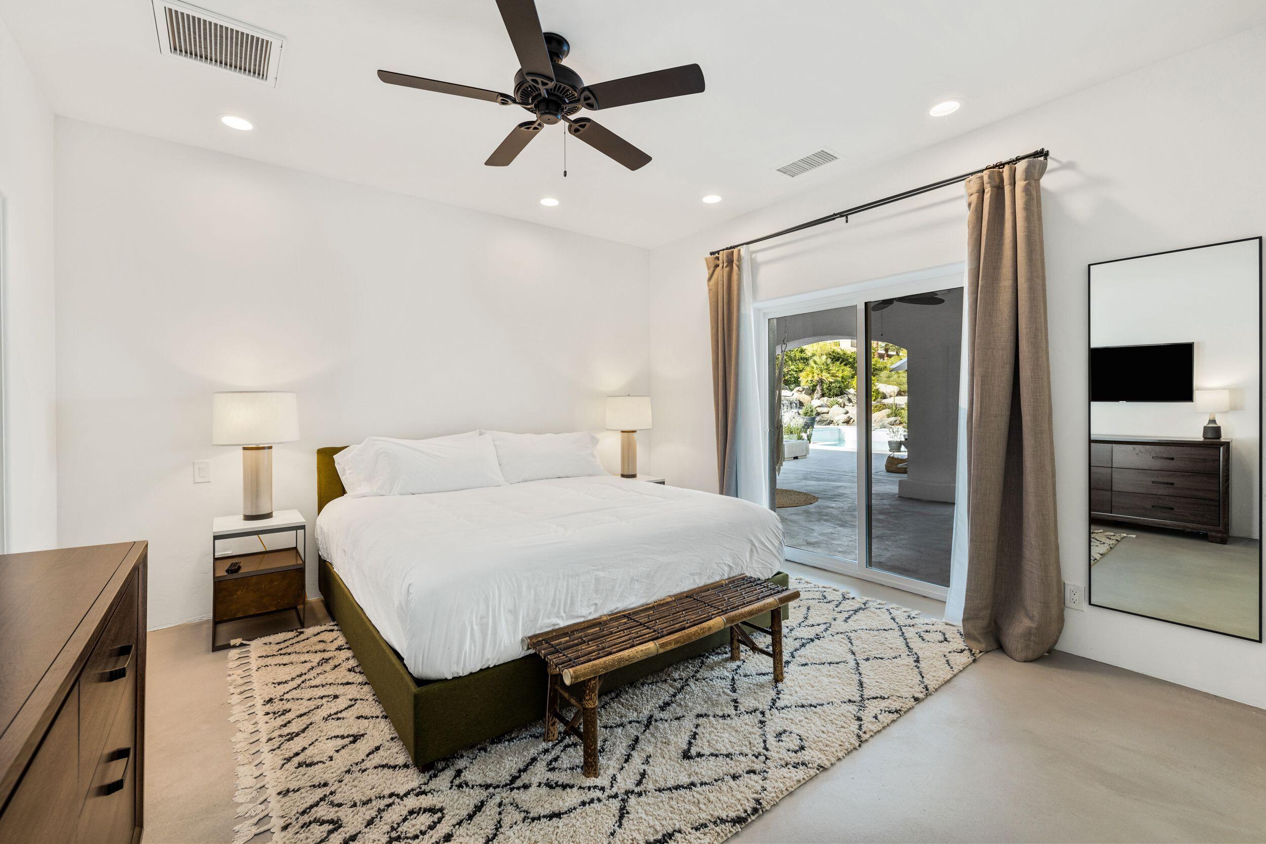 594 West Stevens Road Palm Springs, CA 92262 - Photo 16 of 28 a bed room with a bed and a walk in closet